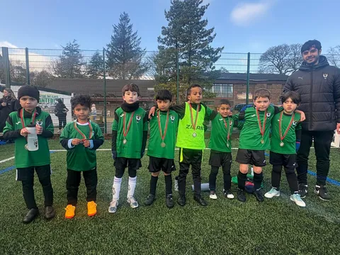 Young FC Babylon players lined up with their medals